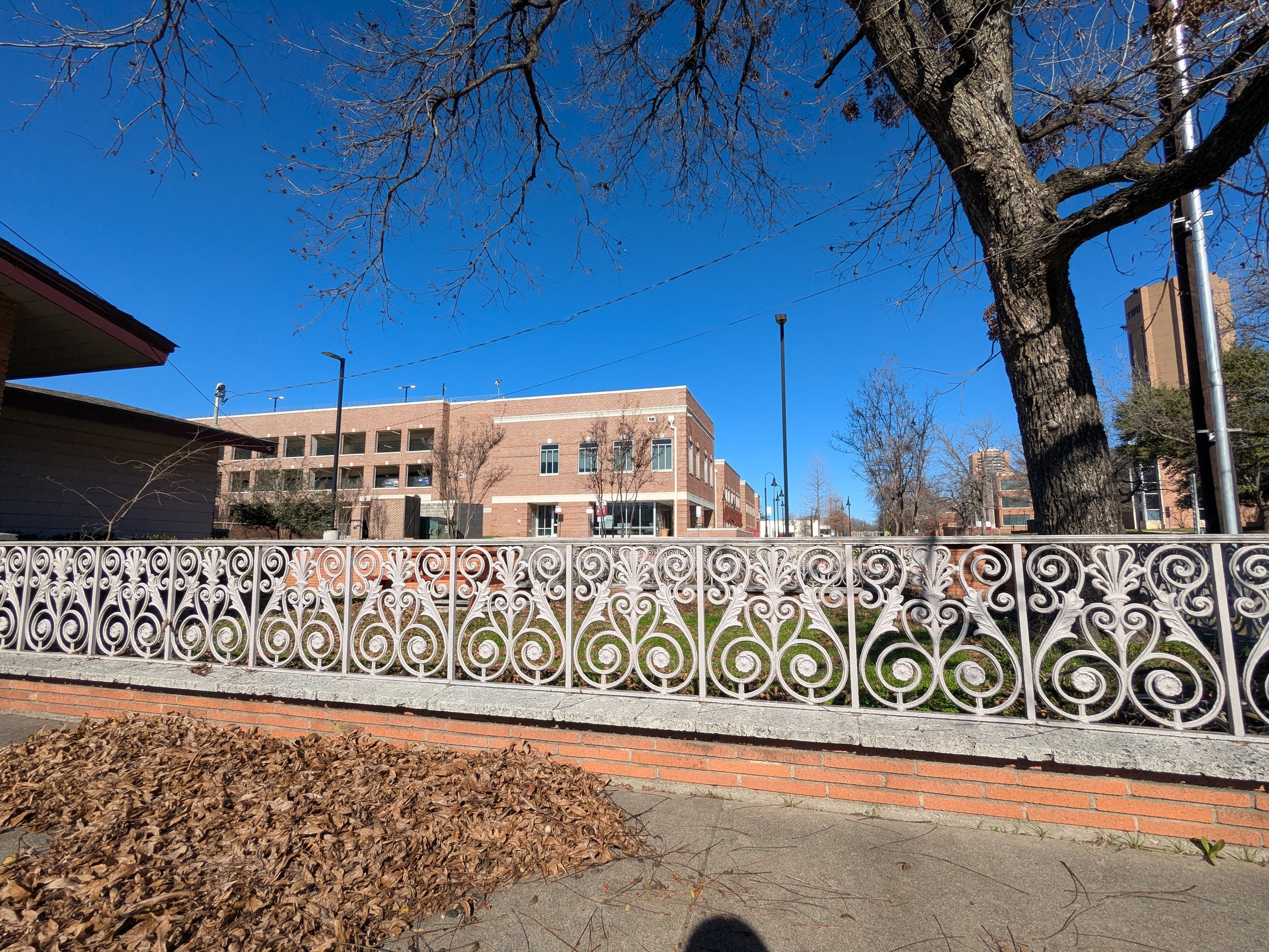 White iron latticework of the Baptist Student Union building at TWU.