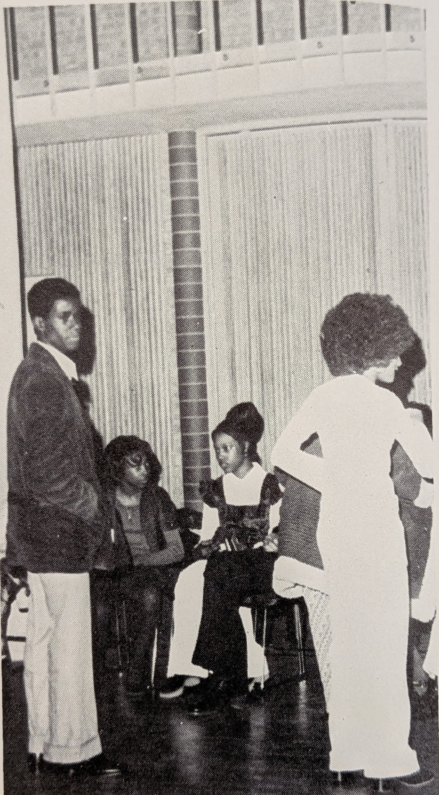 This photo appeared in the 1973 Cougar yearbook for Congress Junior High School. Students are at a school function inside the Denton Civic Center, possibly with FHA. There are three girls and one boy.