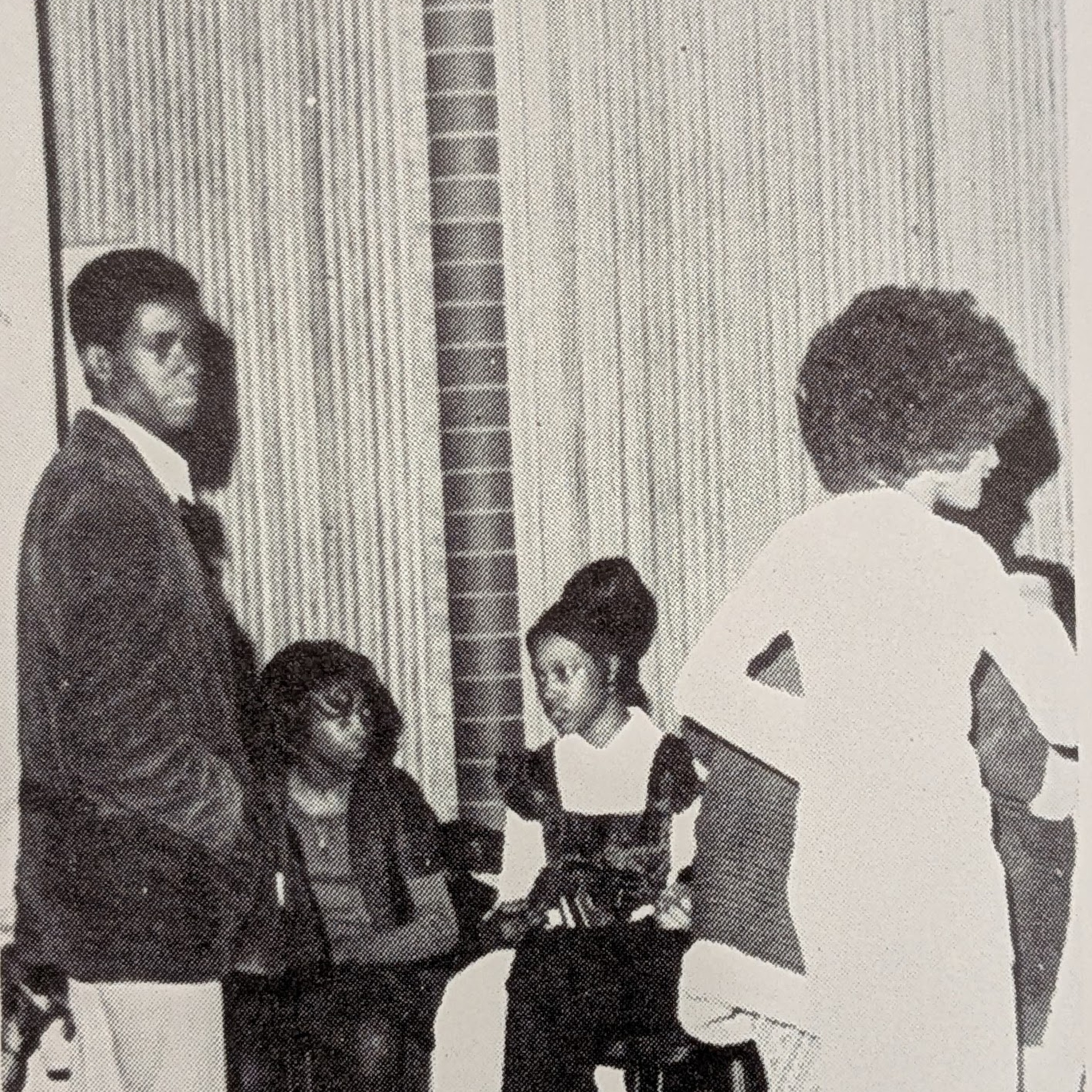 This photo appeared in the 1973 Cougar yearbook for Congress Junior High School. Students are at a school function inside the Denton Civic Center, possibly with FHA. There are three girls and one boy. 